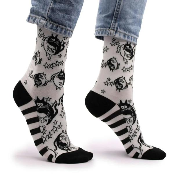 White bamboo crew socks with black cat faces, stars, and striped cuffs