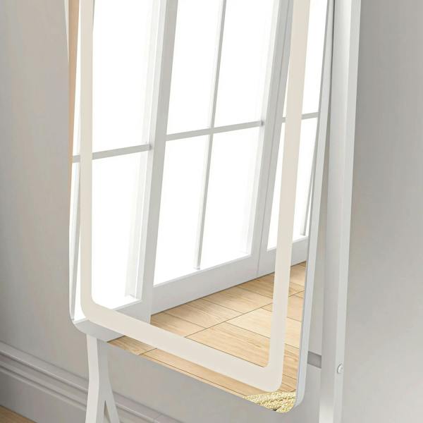 White full-length mirror close-up showing curved frame edge and reflective glass