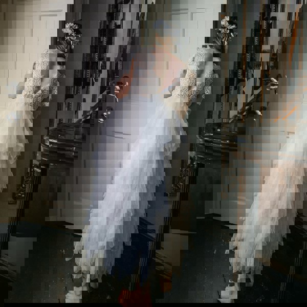 Girl wearing dress and holding flower bouquet