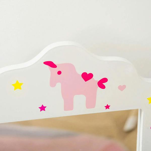 White tri-fold mirror top trim with pink unicorn decal and colorful star accents