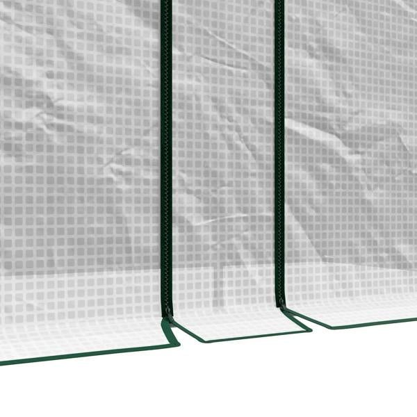 White greenhouse fabric with green vertical supports and reinforced base edge