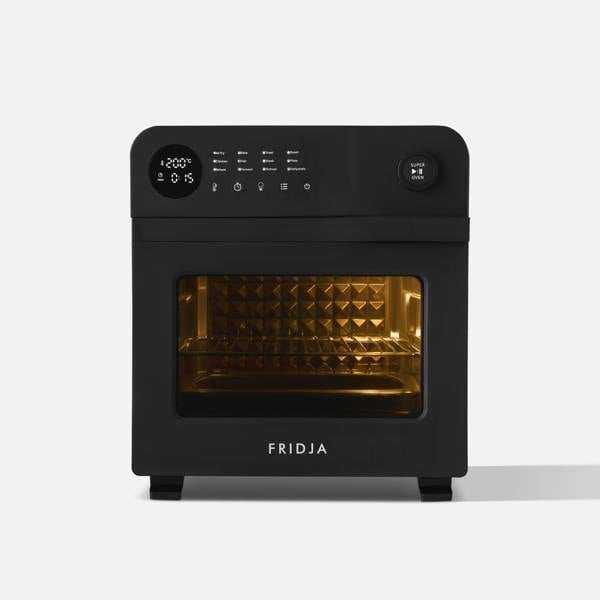 The Fridja f66 Super Oven is a black 15L digital air fryer oven with a display, control buttons, a knob, and a glass door revealing an illuminated interior. It features convection cooking for even results. The Fridja brand is printed at the bottom.