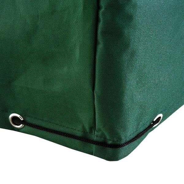 Green patio furniture cover corner with stitched edge and eyelets for fastening