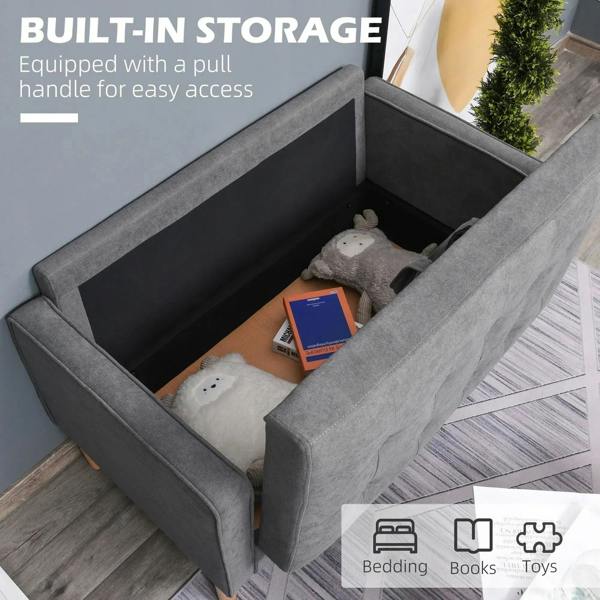 Grey sofa with hidden storage compartment and pull handle, shown open