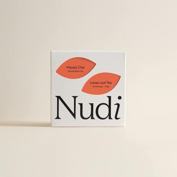 Nuditea masala chai luxury tea box featuring bold orange and spice-toned labels