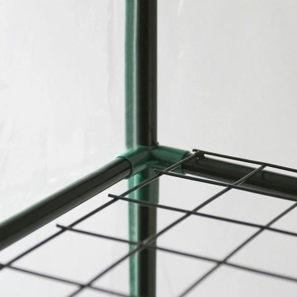 Mini greenhouse with four tiers, featuring a sturdy black wire shelf and a clear plastic cover for optimal plant growth