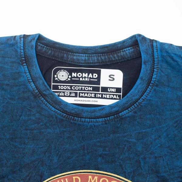 Blue T-shirt inner neck tag with “Nomad Sari” and “100% cotton, made in Nepal”