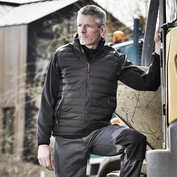 Man wearing the Tuffstuff Elite bodywarmer whilst working