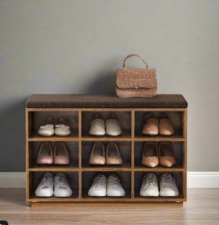 Storage shoe bench with padded seat and nine compartments, adjustable shelves in hallway setting

