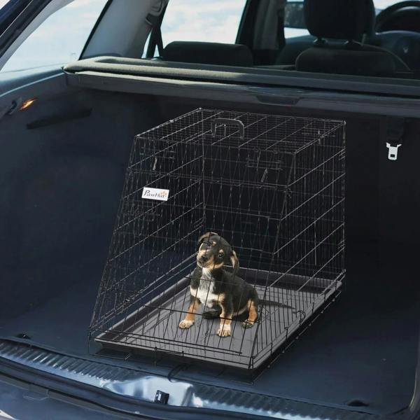 Black metal collapsible dog travel crate with removable tray and door front view