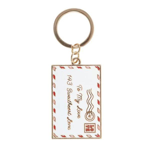 Gold-tone heart keyring with square enamel love-letter design and keychain ring