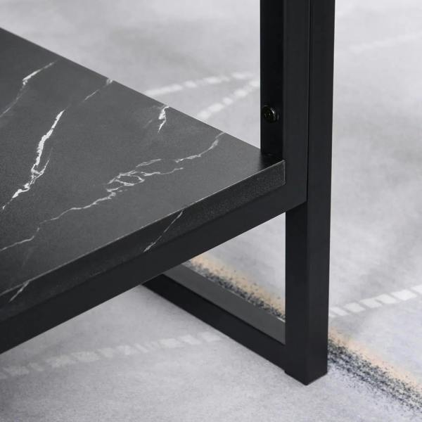 Close-up of black metal side frame and faux marble tabletop edge on two-tier coffee table