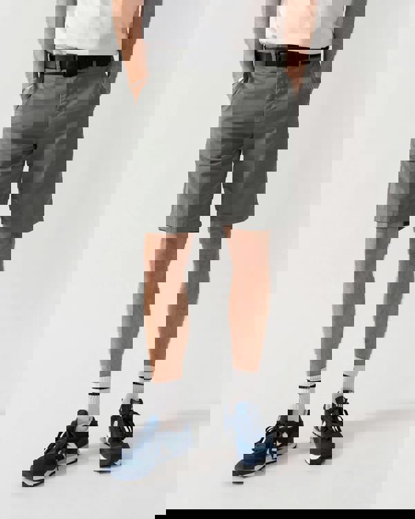 studio shot of a model wearing a BOSS Green Paddy Mens Cotton-Piqué Polo Shirt with Contrast Logo in Open White 115