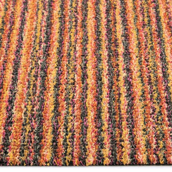 Close-up of a multicolored striped fabric with orange, yellow, and red hues.