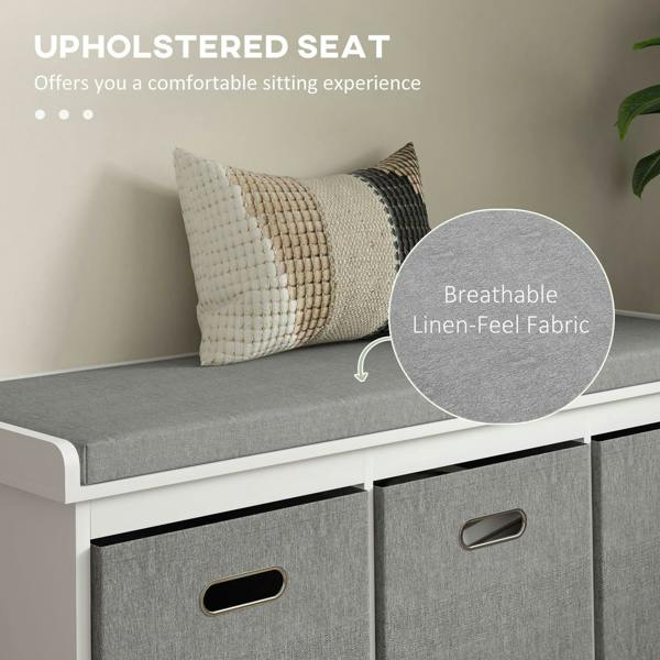 White shoe storage bench with upholstered padded seat and three gray storage drawers