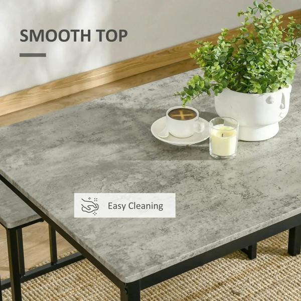 Grey concrete-effect tabletop with smooth surface and steel table legs