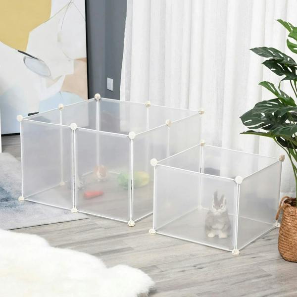 White plastic pet playpen enclosure with two connected sections, small animals inside