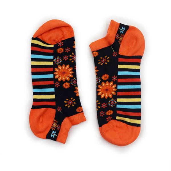 Pair of low-cut bamboo socks in black with orange, blue, yellow stripes and floral motifs.