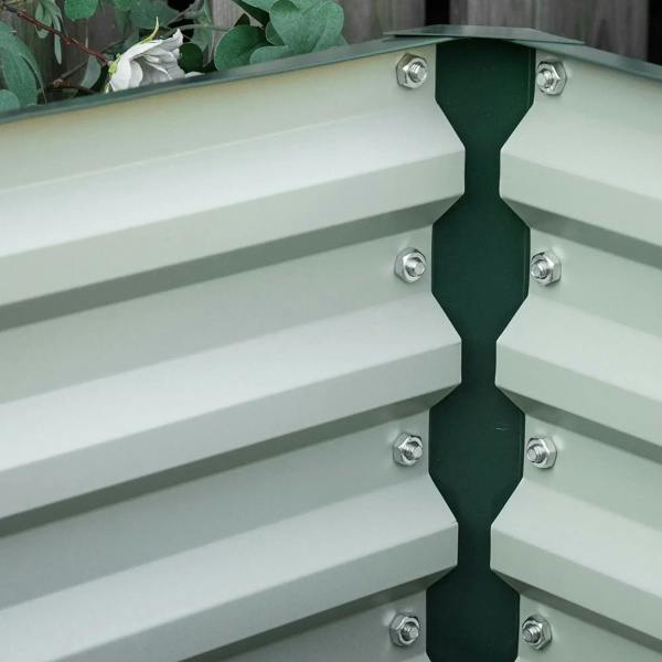 Green steel planter box corner seam with hex bolts
