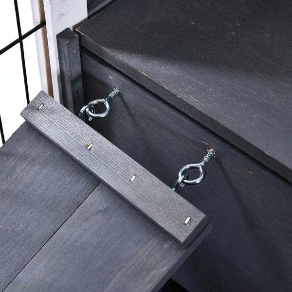 Grey wooden guinea pig hutch metal latch and ring handle on base panel