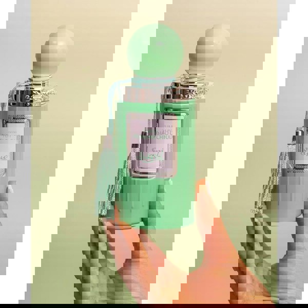 Sapil Yummy Pistachio Oud bottle held in hand