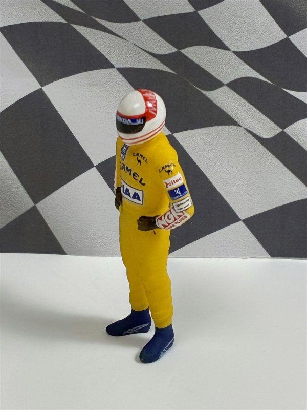 a toy figure in a yellow uniform