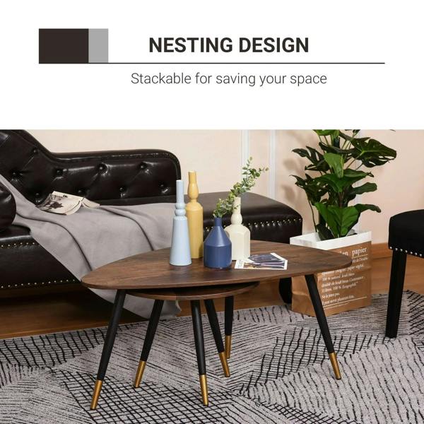 Walnut round coffee table set with black legs and gold tips on patterned rug