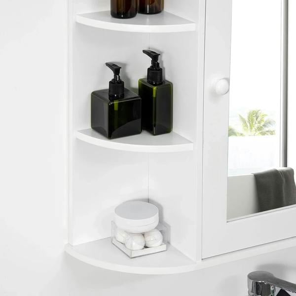 White bathroom wall cabinet interior with two shelves holding pump bottles, mirrored door and knob