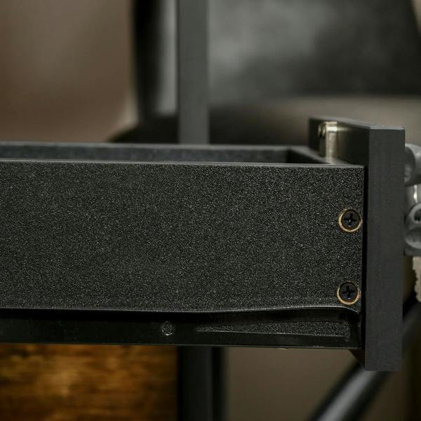 Black metal lock bracket with screws on a drawer slide