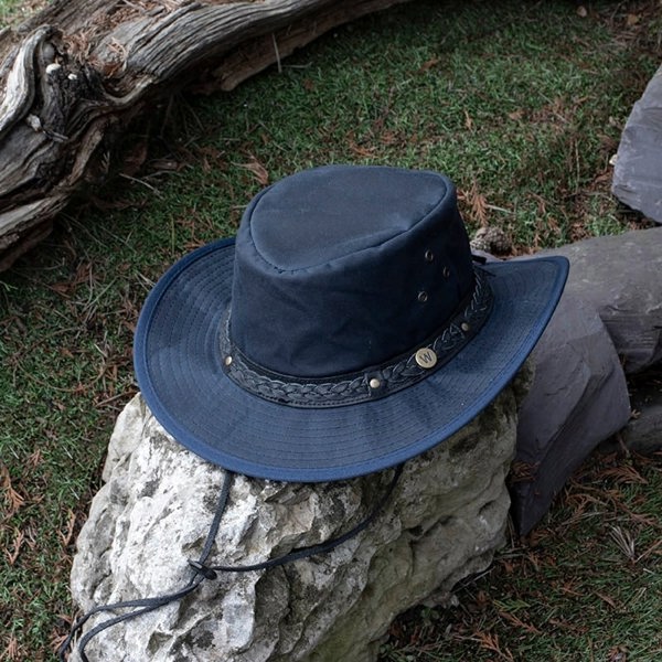 The wilderness navy waxed cotton unisex hat by Wombat