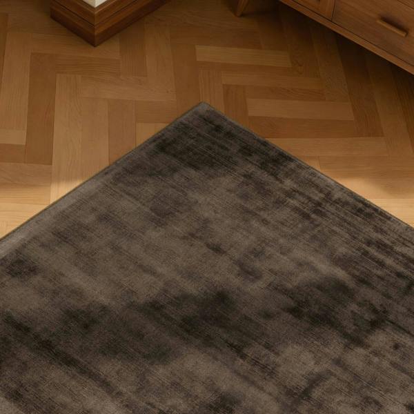 Gray rug on a wooden floor