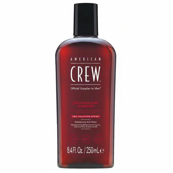 American Crew shampoo bottle on a white background