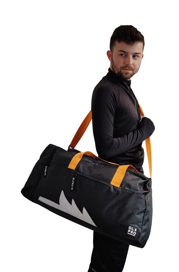 Black 40L Holdall OLPRO man carrying bag on shoulder