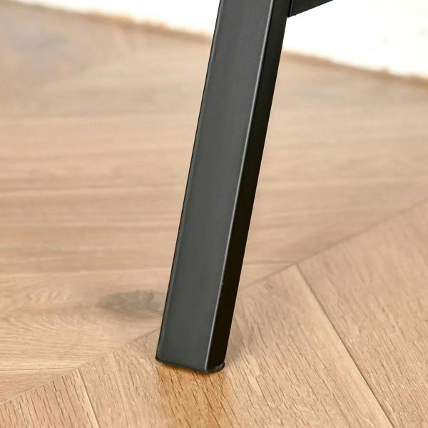 Black steel desk leg with angled profile on light wood floor