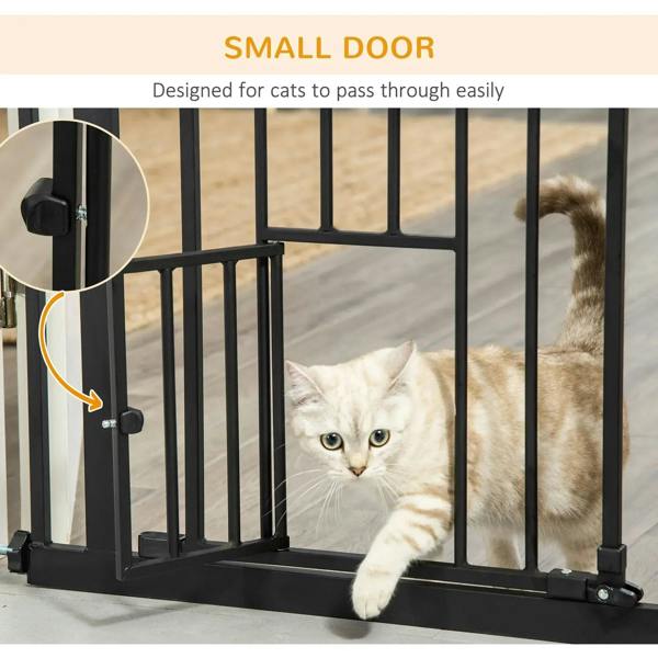 Black pet gate with small cat flap door on the lower panel