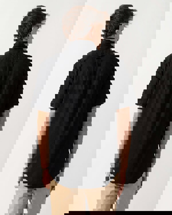 Back shot of a Model wearing a Belstaff Scale Mens Short Sleeve Shirt in Black