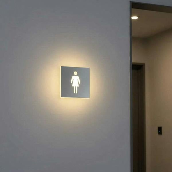 LED female toilet sign on the wall outside a female WC