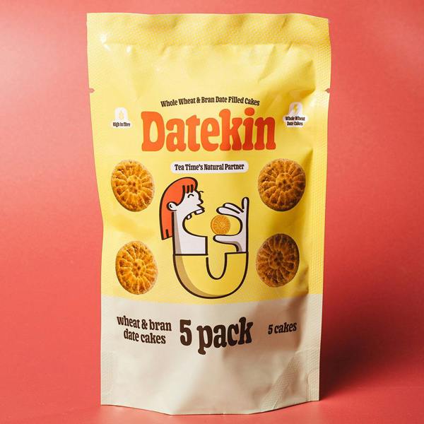 Packaging of Datekin 5-pack wheat and bran date cakes with images of cakes on a red background