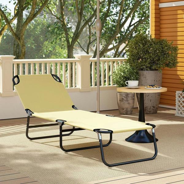 Beige sun lounger with padded seat and black frame on outdoor balcony deck