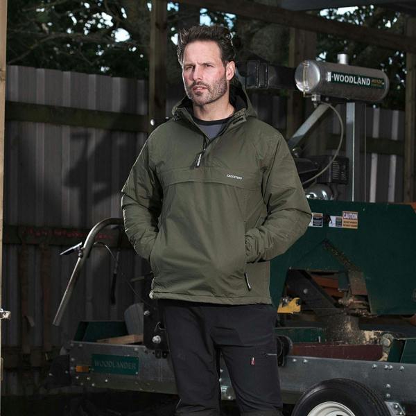 Man wearing Tuffstuff Sutherland Waterproof Windbreaker Jacket in Olive