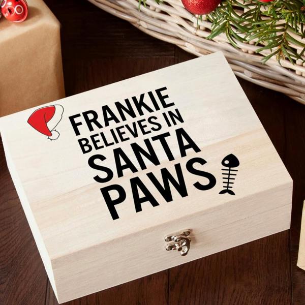 Personalised natural wooden Christmas Eve box for cats featuring Frankie Believes in Santa Paws print with a fish bone icon