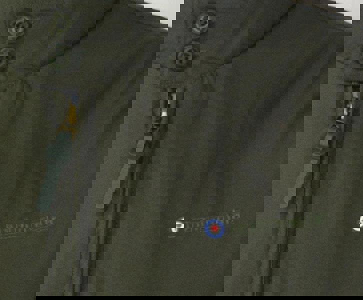 Lambretta Mens Showerproof Classic Harrington MOD Scooter Jacket Coat, close-up of the jacket's zipper and embroidered Lambretta logo.