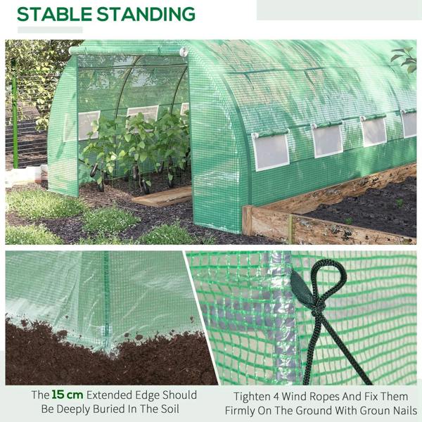Green walk-in greenhouse tent with mesh windows and zippered door set over a raised bed