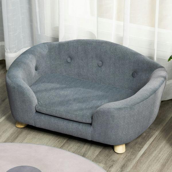 Grey pet sofa bed with curved sides, plush seat, button-tufted back, and wooden legs