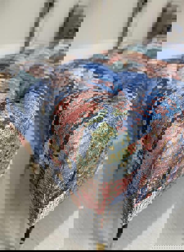 Close-up of textured Damascus fabric on storage footstool cushion - ISTOOLS