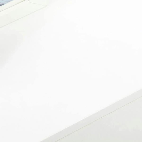 White cabinet drawer front with gold handle and smooth finish