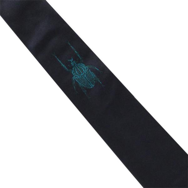 Paul Smith narrow silk tie in a single jacquard beetle pattern