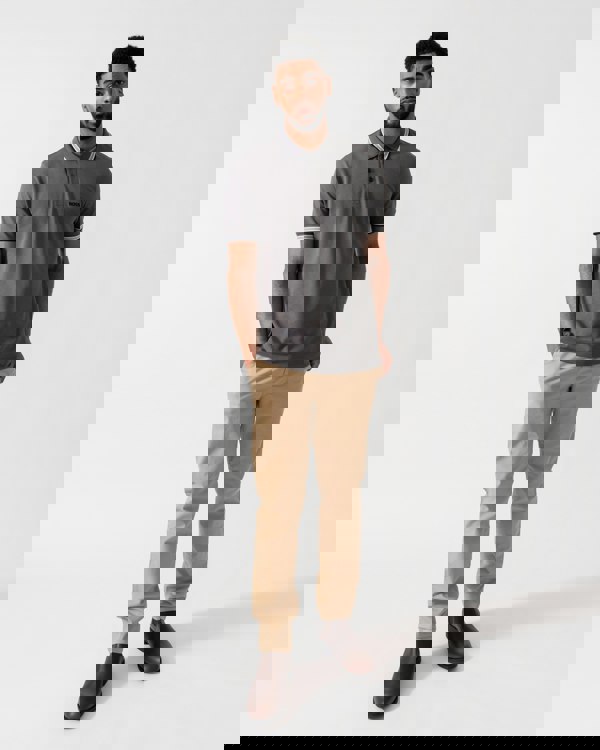 Model wearing BOSS Green Mens Paddy Cotton-Piqué Polo Shirt with Contrast Logo in Open Grey 071 - full length