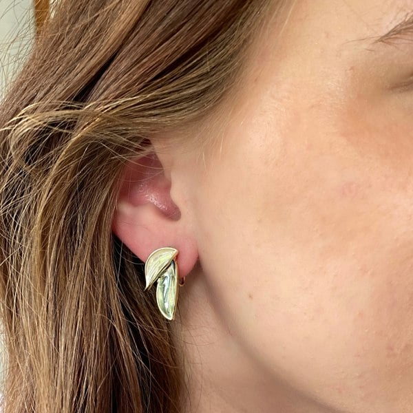 Gold leaf clip-on earrings, dual leaf design, textured gold finish, iridescent detailing, vintage inspired style, lightweight statement jewellery, elegant botanical accessory
