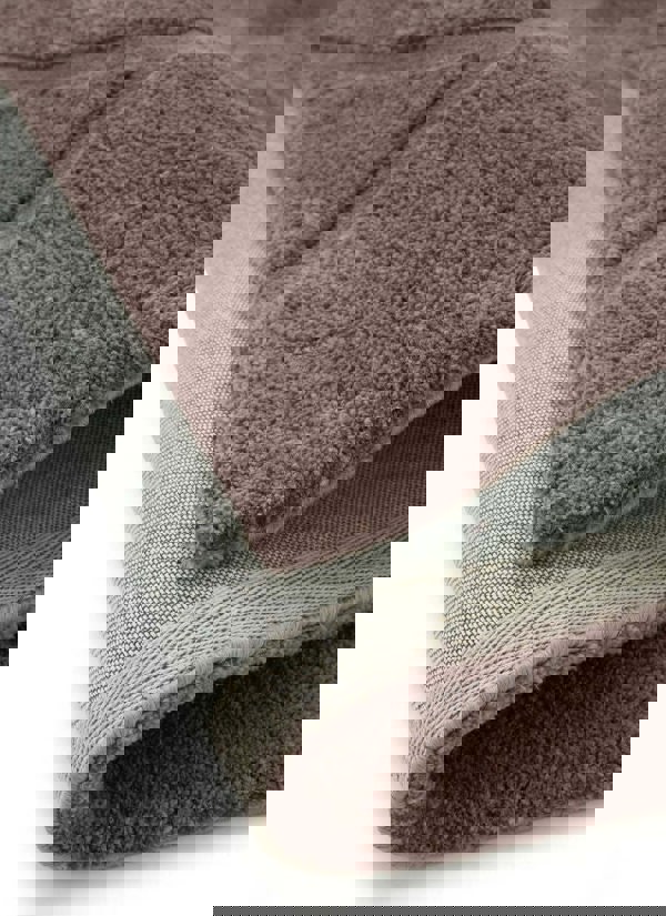 Soft cream and grey Scandinavian deep pile rug showcasing plush texture and durable cotton backing.